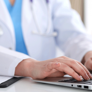 doctor at macbook